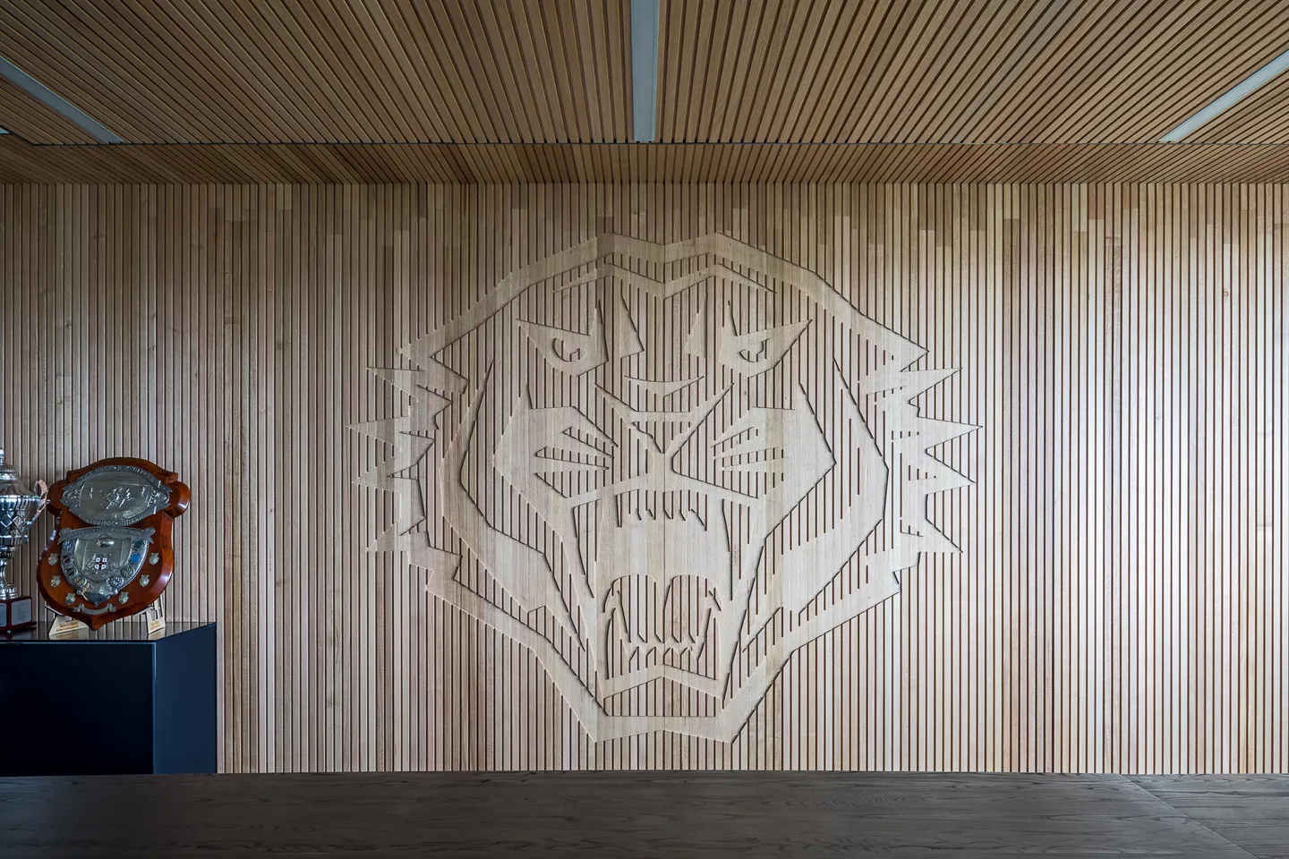 Timber wall panelling with the Tigers emblem — West Tigers Centre of Excellence