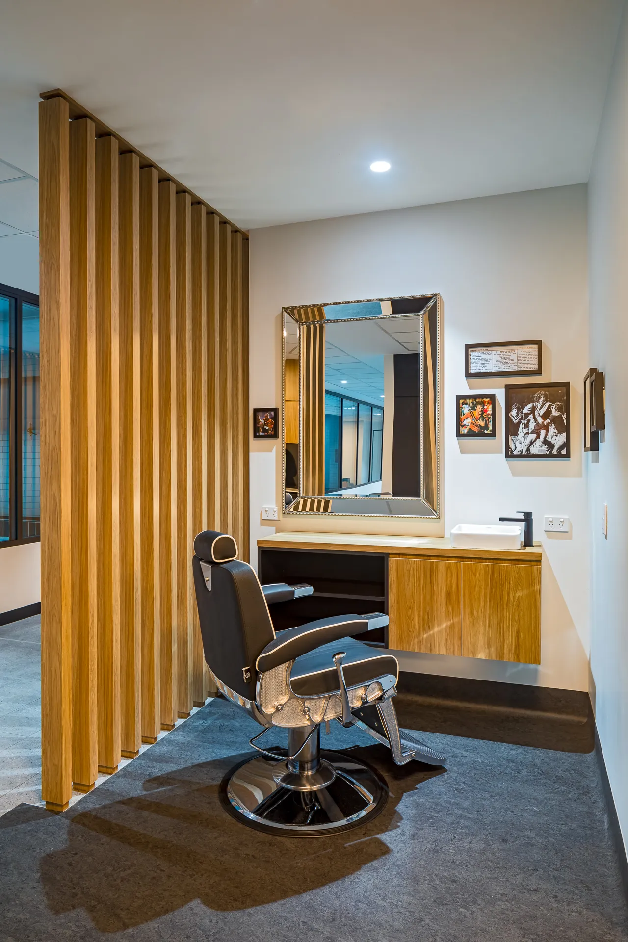 Grooming station with timber joinery and barber chair — West Tigers Centre of Excellence